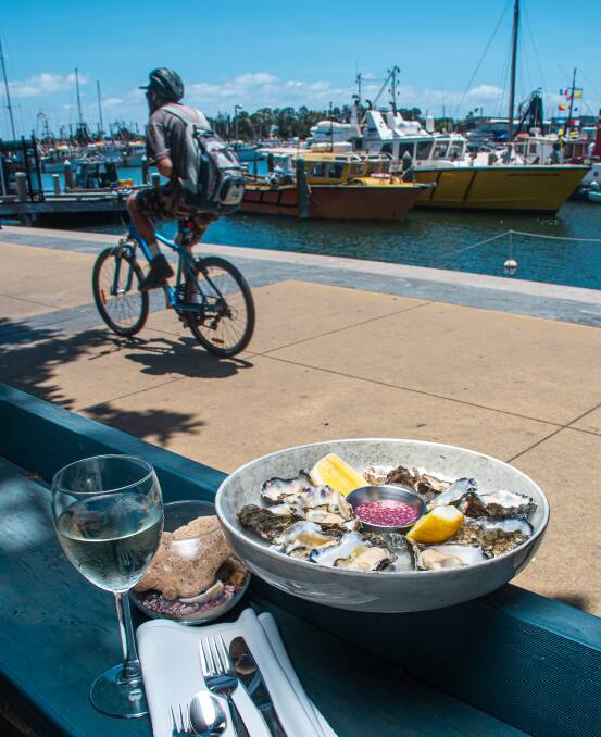 FRESH: A plate of a dozen Sydney rock oysters from Pindimar at Port Stephens served at Newcastle Cruising Yacht Club with french mignonette. Picture: Simon McCarthy
