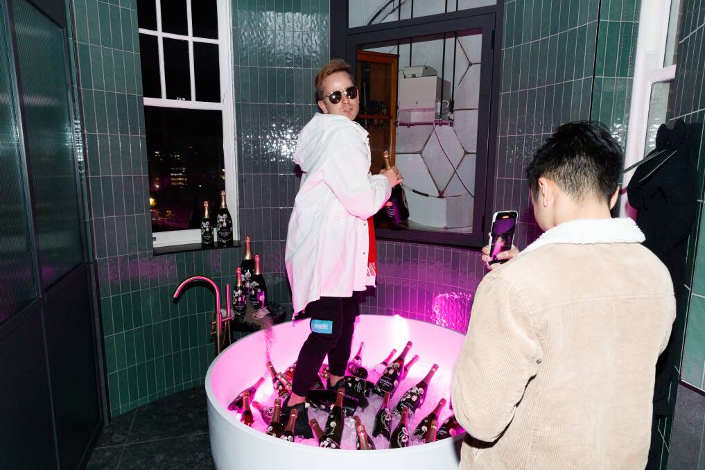 Instagrammable: Jumping into a ice-packed spa tub full of bubbly. Picture: Max Mason-Hubers