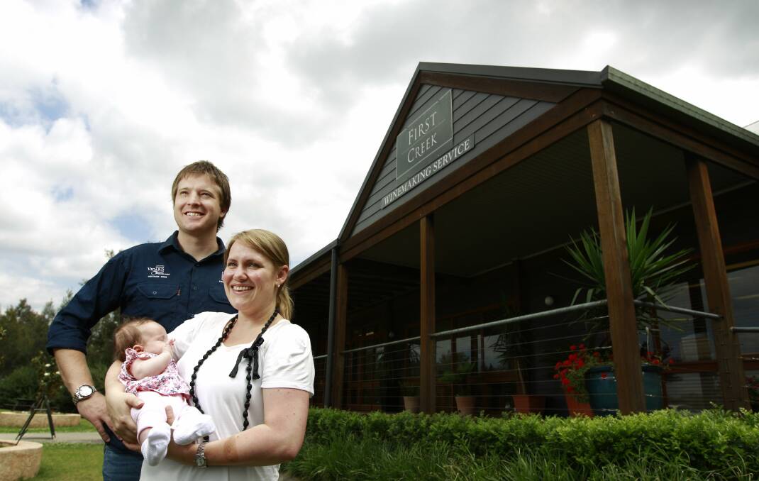 HANDS FULL: Shaun and Liz Silkman in November 2011 with first-born daughter Isabelle at First Creek winery. Picture: Peter Stoop