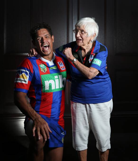 Super fan: Patty Smith, who wasn't even five feet tall, with star player Dean Gagai celebrating the Knights' season launch in 2017. Picture: Marina Neil