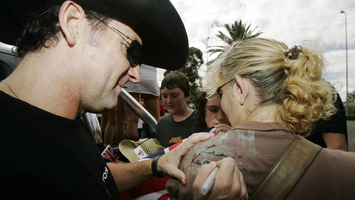 Roots: Kernaghan signing an autograph in Tamworth in 2008.