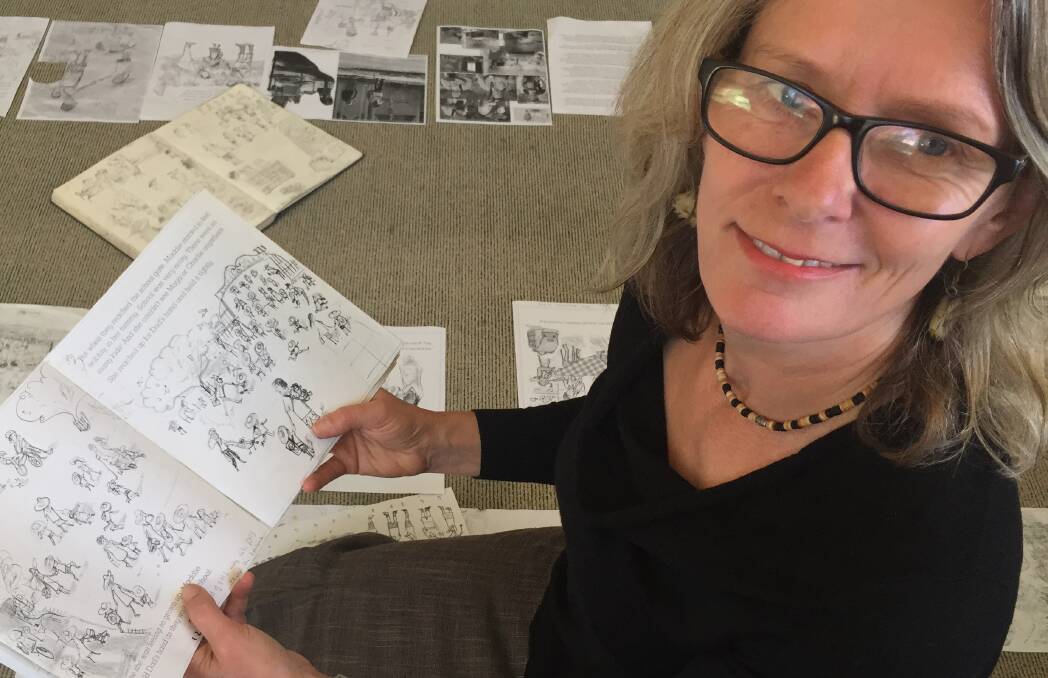 On the drawing board: Liz Anelli with rough sketches that will be used in First Day, a 32-page children's picture book with story by Penny Matthews. Picture: Jim Kellar