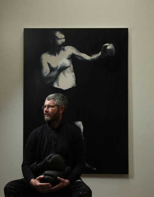 Back to boxing: Nigel Milsom with a new work in his Wickham studio. Picture: Simone De Peak