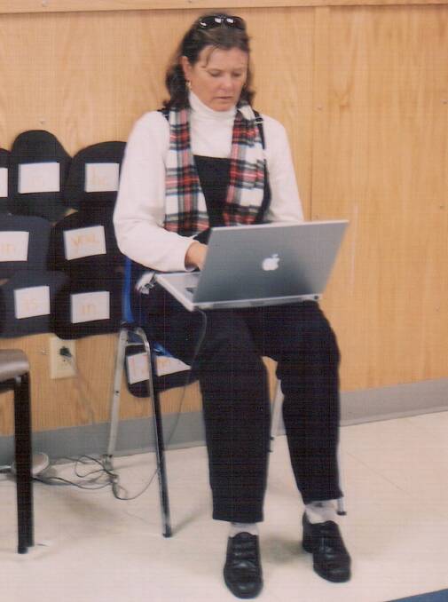 Julia Campbell waiting at Gander International Airport for her flight home in 2001.
