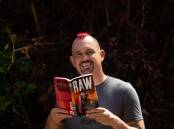 Mental health advocate Damien Linnane with his memoir, Raw. Picture by Jonathan Carroll
