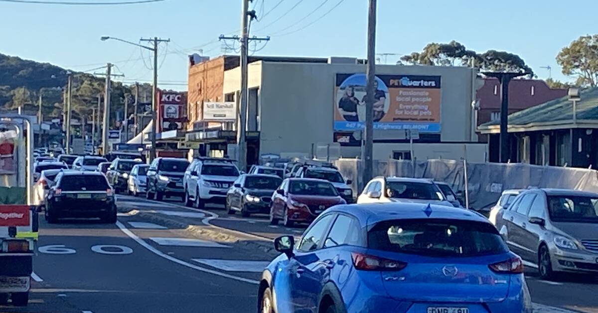 PRESENT DAY: Morning and evening peak hour traffic through Belmont on the Pacific Highway is a slog. Picture: Jim Kellar