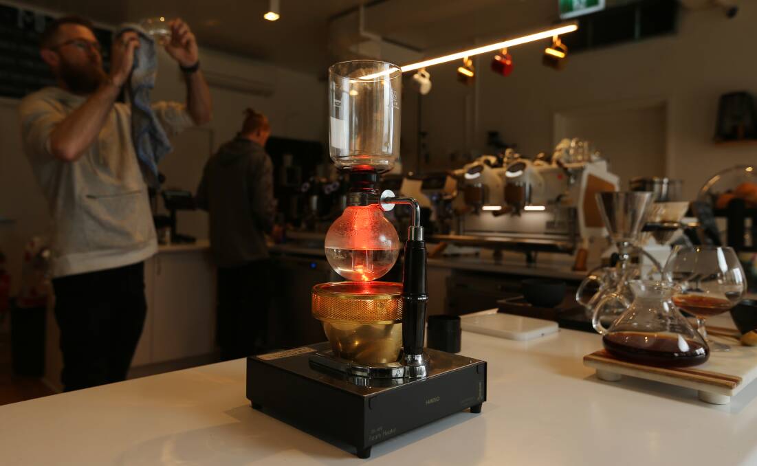 Special: Brewing Kenyan coffee with a syphon at Brew Tales, one of the oldest methods in the world. Picture: Simone De Peak