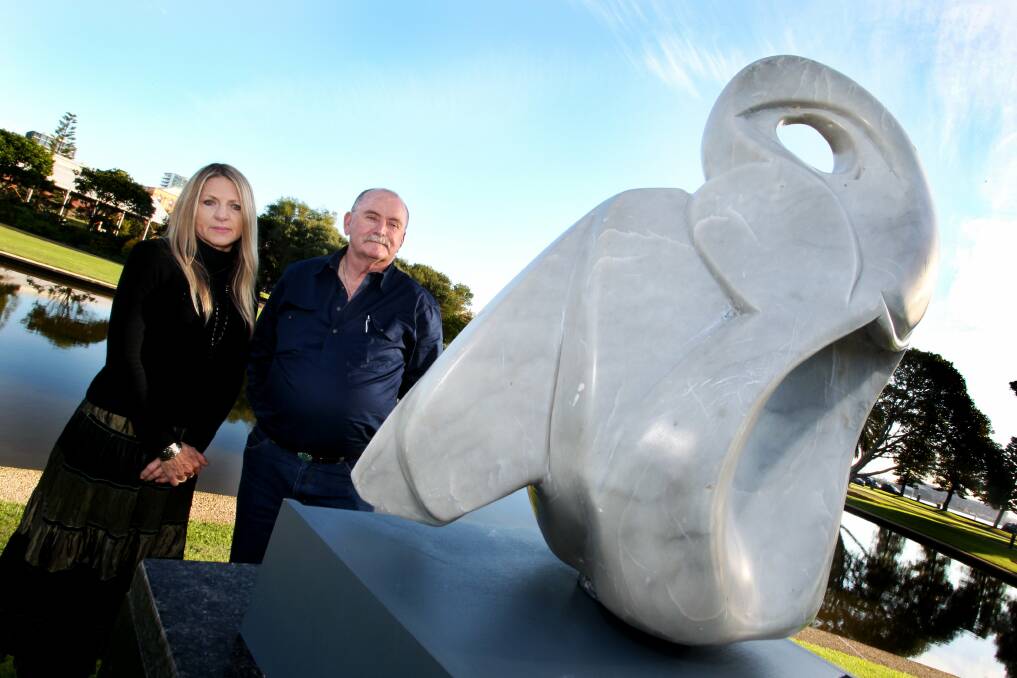 Mental health advocate Joanne Sinclair with sculptor Roger McFarlane with a small scale of the Resilience sculpture that was created in Foreshore Park Newcastle in 2015.
