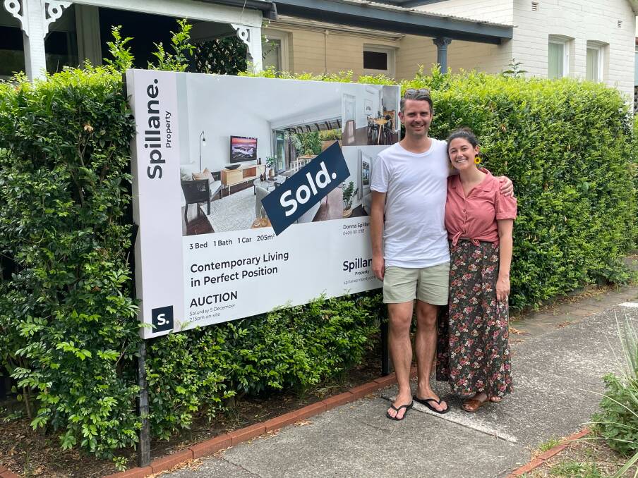 Glad to be in it: Chad Bennett and Emma Levine in front of their first home.