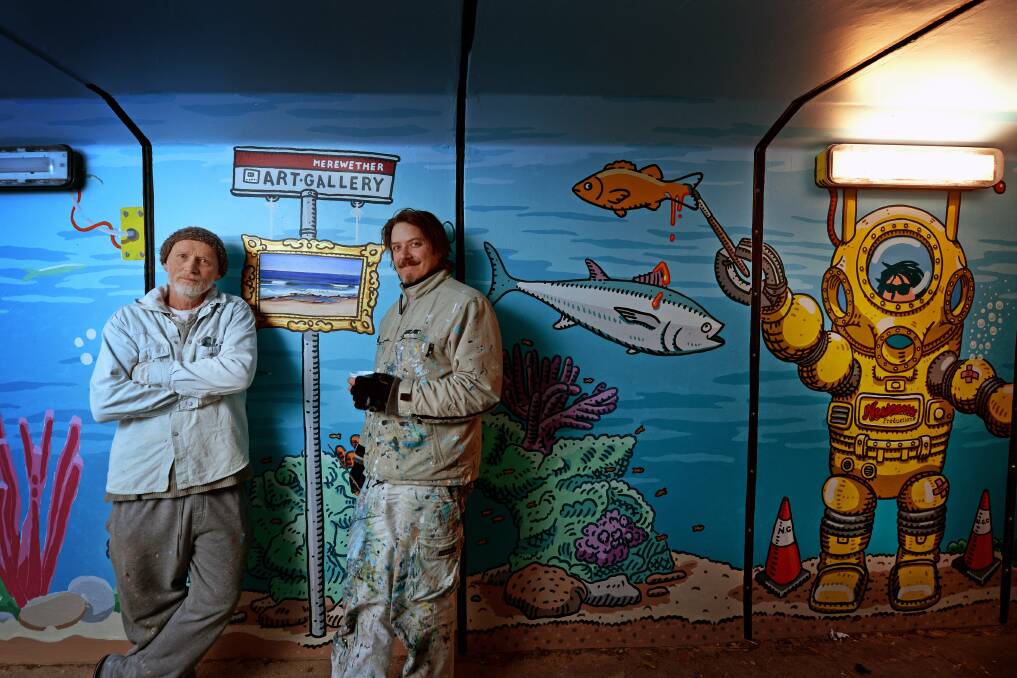 Living history: Artists John Earle and Trevor Dickinson in a candid moment during the painting of the mural The Amazing Merewether Aquarium.