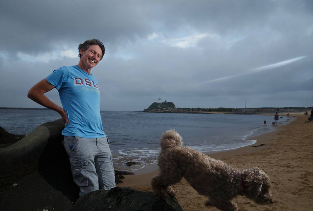Beach lovers: Michael Bell and his dog, Larry, at Horseshoe Beach, aka Dog Beach, this week. Picture: Max Mason-Hubers