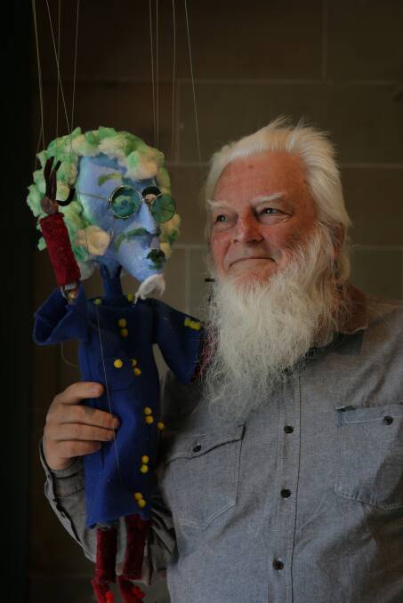 Wizardry: Frank Oakes with one of his puppets on display at Maitland Regional Art Gallery. Picture: Simone De Peak