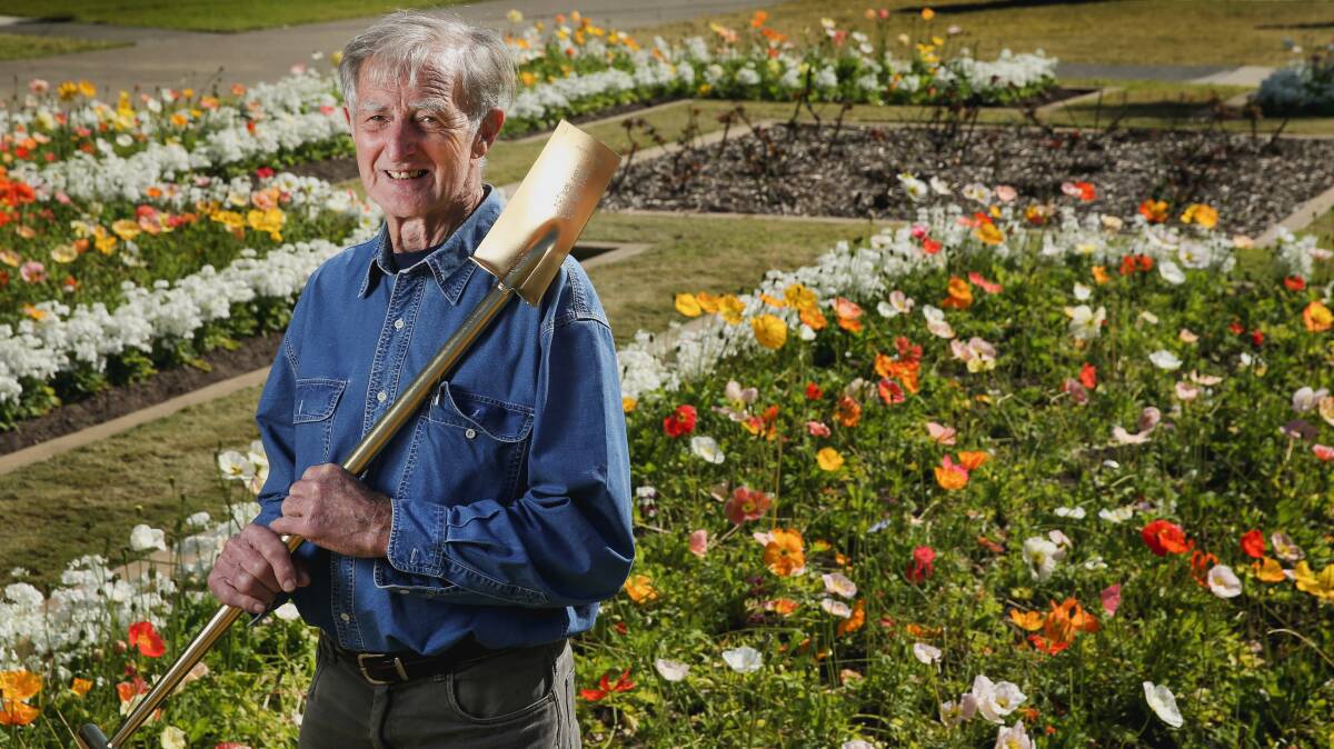 Modest gardener: John Le Messurier with his golden spade at Civic Park. He enjoyed looking at the park and its gardens every work day and often met his family there when he worked for Newcastle City Council. Picture: Marina Neil