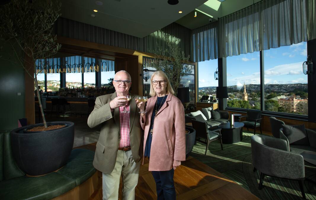 Cheers: Warren and Pam Stewart of Adamstown, the first guests to check in to the Crystalbrook Kingsley. Pictures: Marina Neil