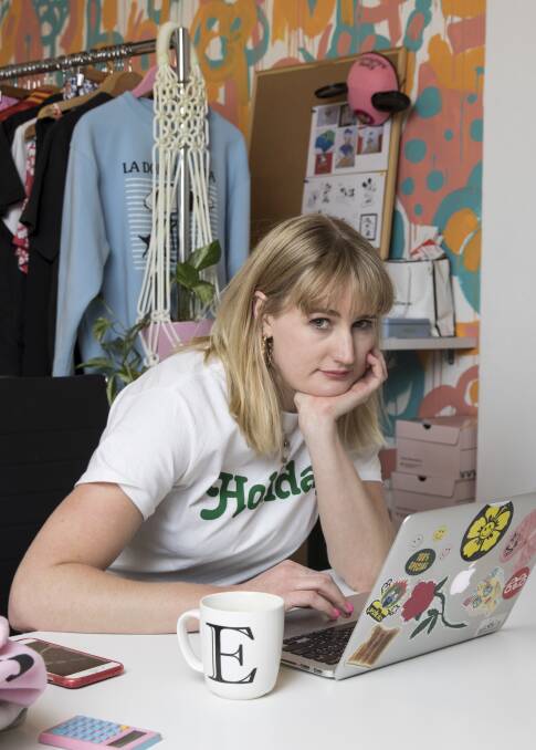 Focused: Fashion designer Emma Mulholland in her Sydney studio in Surry Hills. She's wearing a T-shirt  from her Holiday collection. Picture: Jessica Hromas