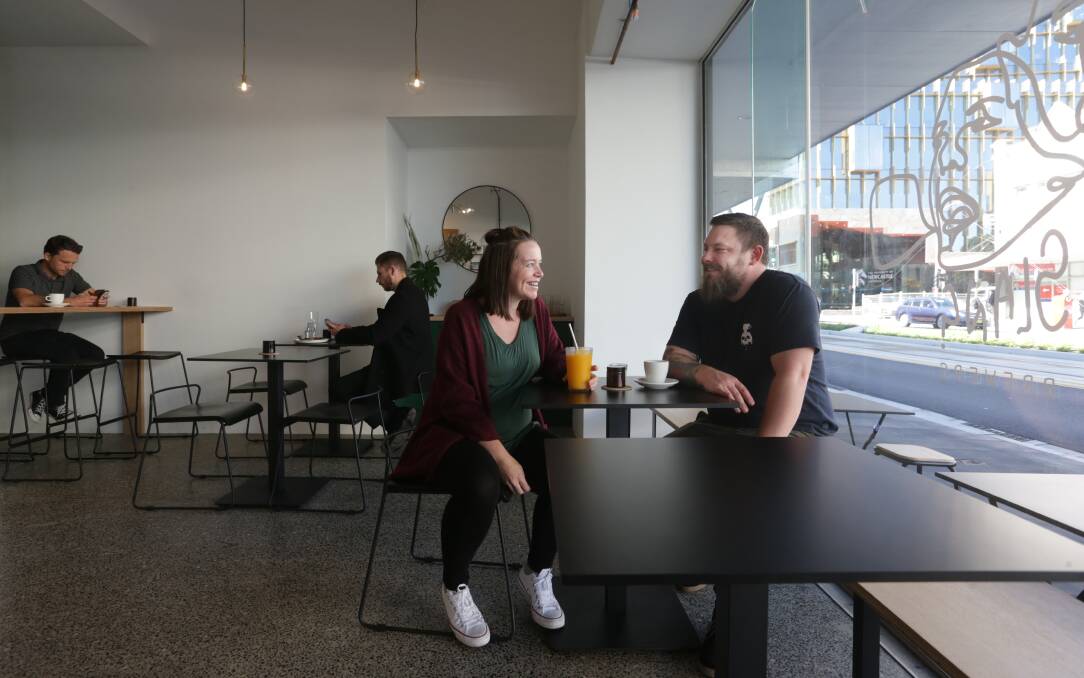 Inside: Alaric Daley and partner Sara in the modern New Slang cafe. Picture: Simone De Peak
