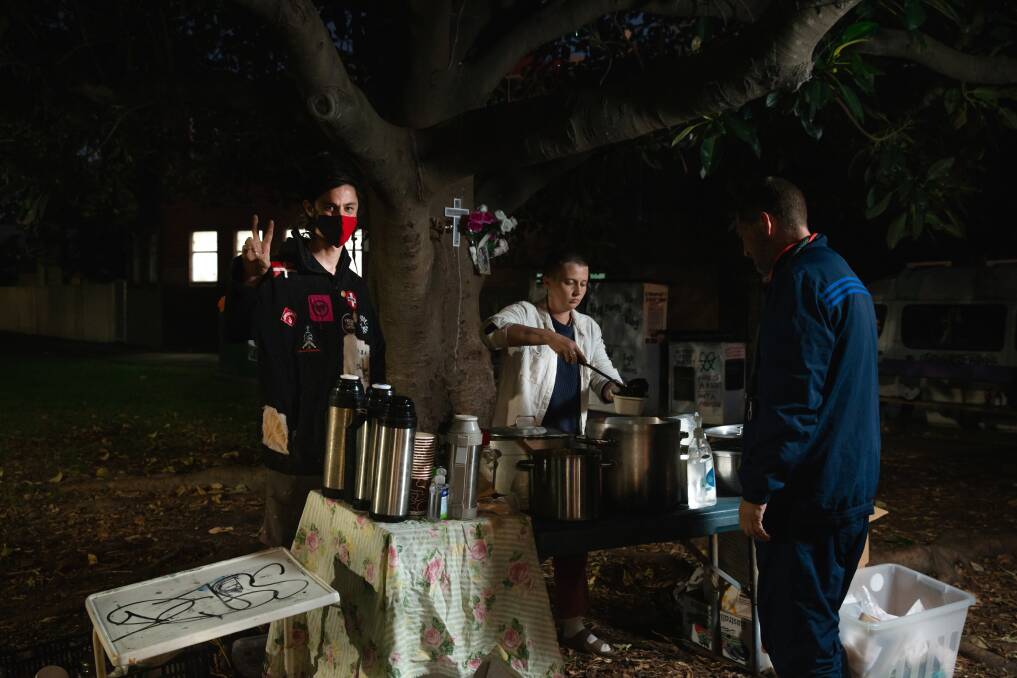 Food Not Bombs: Beth Dwyer and Quinn Squires serving food at a park near Hamilton Train Station. Picture: Marina Neil