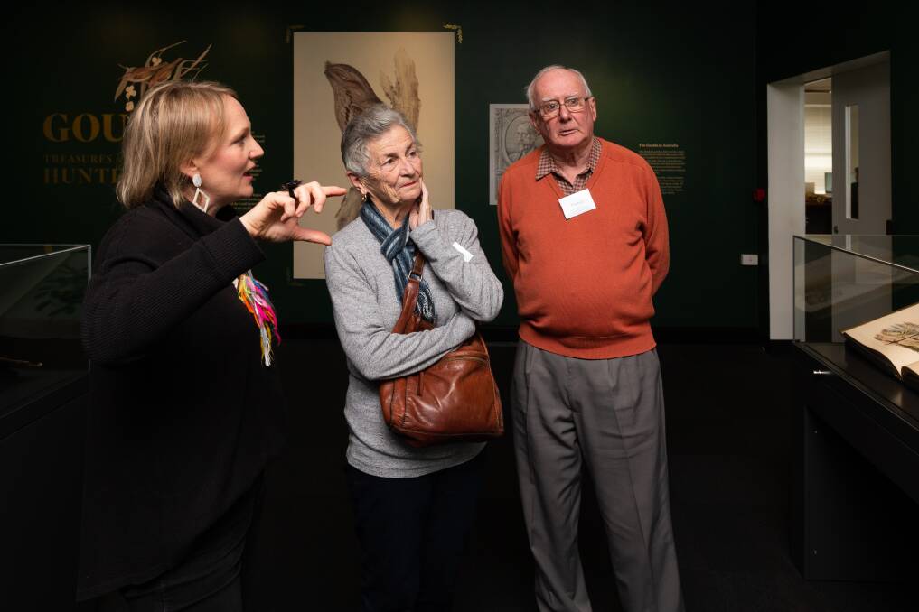 Art therapist Alice Ropata, with Peter and Marie Cunningham, view items featured in the project at Newcastle Library. Picture by Jonathan Carroll
