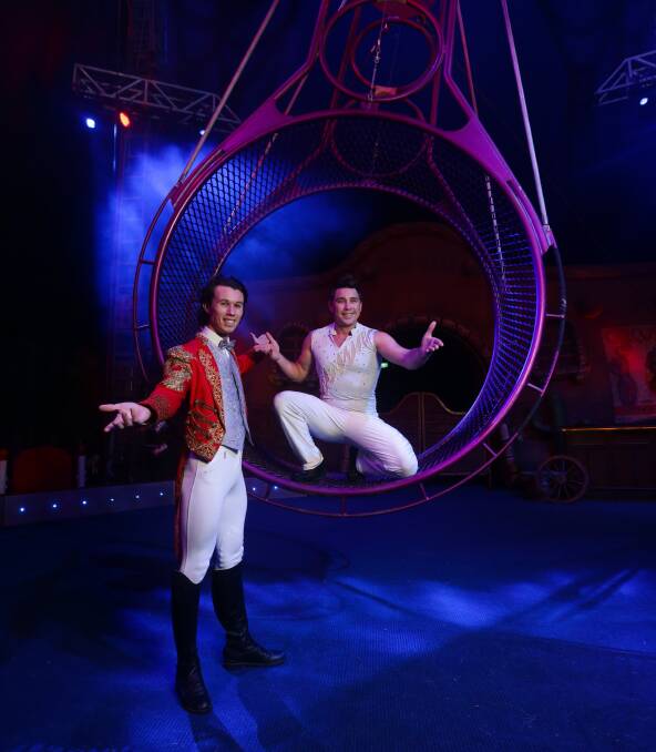  Step right up: Webers Circus ringmaster Jake Larkin, left, and Jansen Grant on the Wheel of Death. Picture: Jonathan Carroll