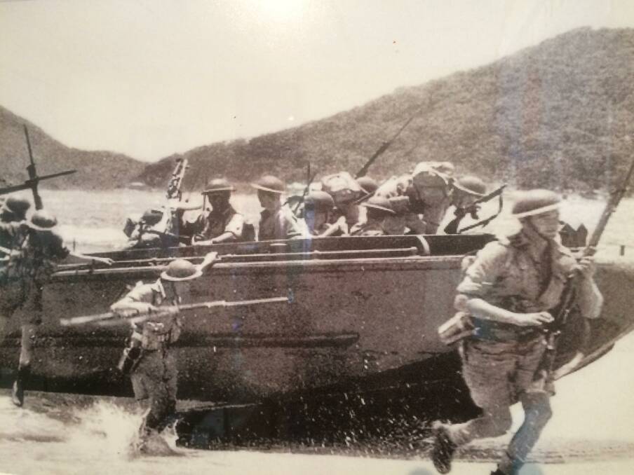 Training: Aussie soldiers practice landings on Shoal Bay beach in World War II against the backdrop of Tomaree headland.