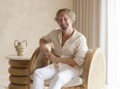 So comfy: Tim Neve in his arch armchair.