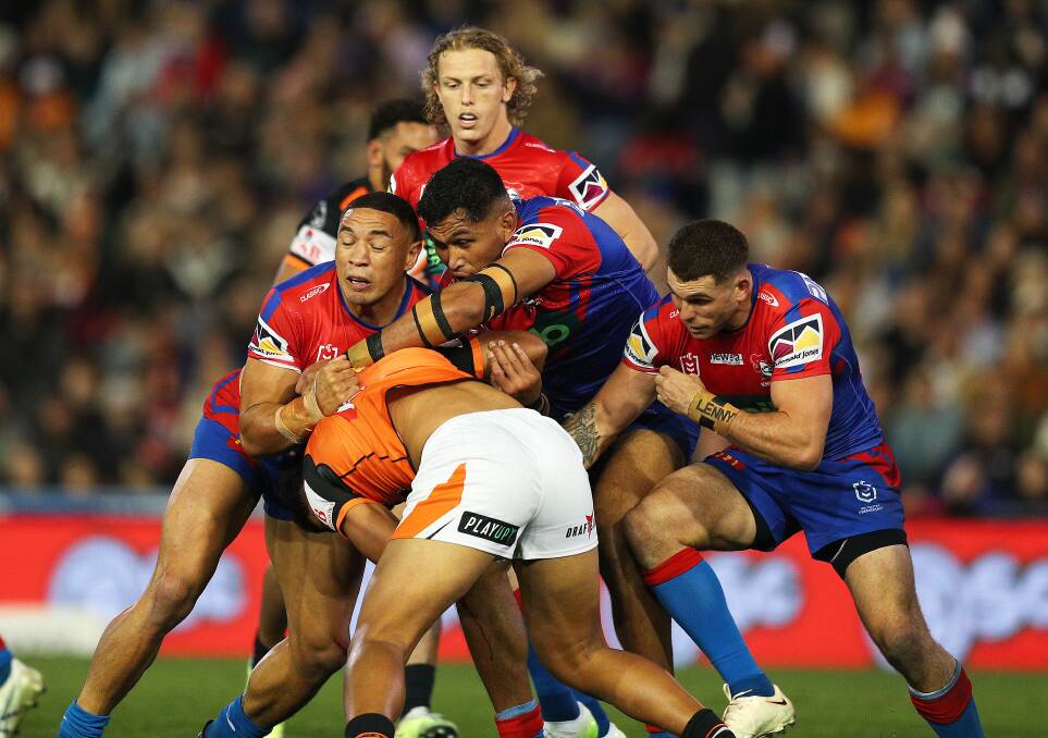 The Newcastle Knights in action against the Wests Tigers on July 14, which the Knights won 34-18. Picture by Peter Lorimer