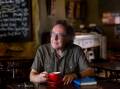 Playwright Carl Caulfield at Goldbergs cafe, the inspiration for his new work, Karma Kafe. Picture by Jonathan Carroll