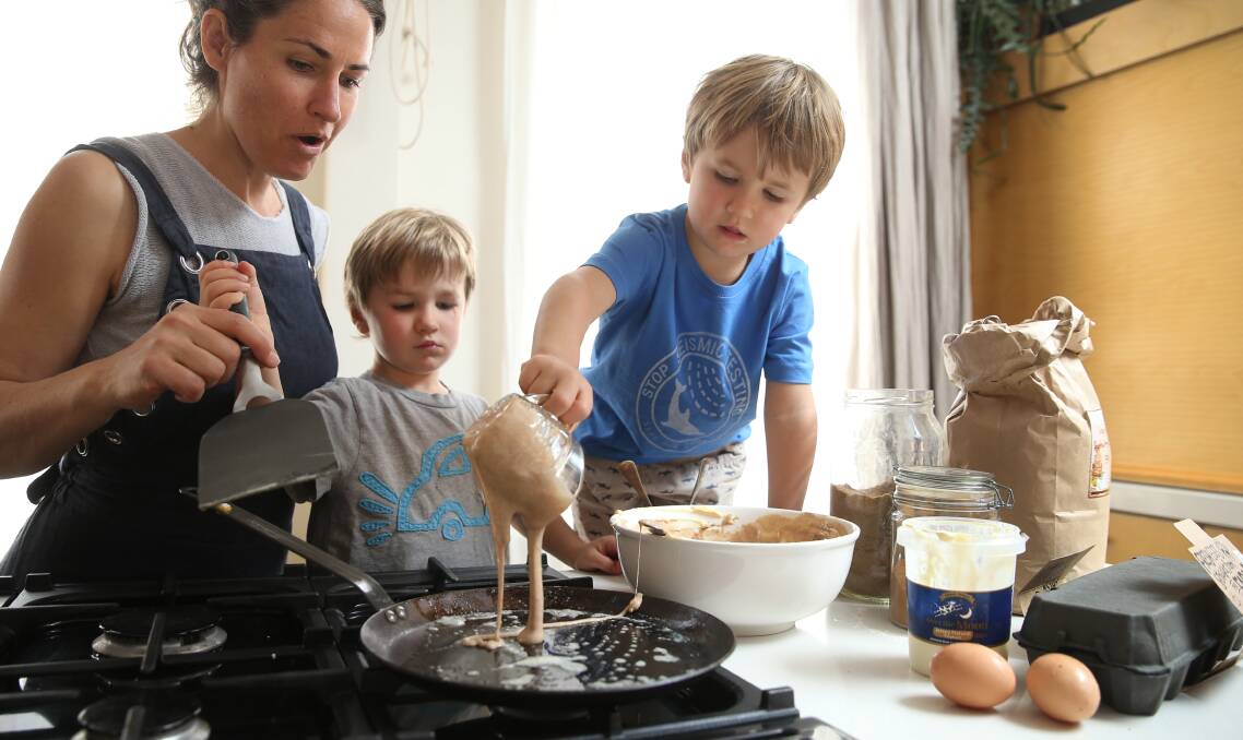 Welcome ritual: Bec Bowie from Estabar at home with her twin boys Van and Alby making pancakes. Picture: Marina Neil 