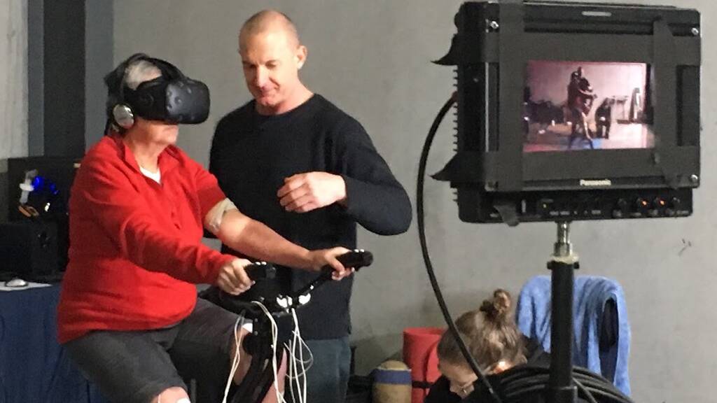 Helping hand: Rohan O'Reilly of Smart Bodies Smarter Minds in Mayfield using VR to help a client.