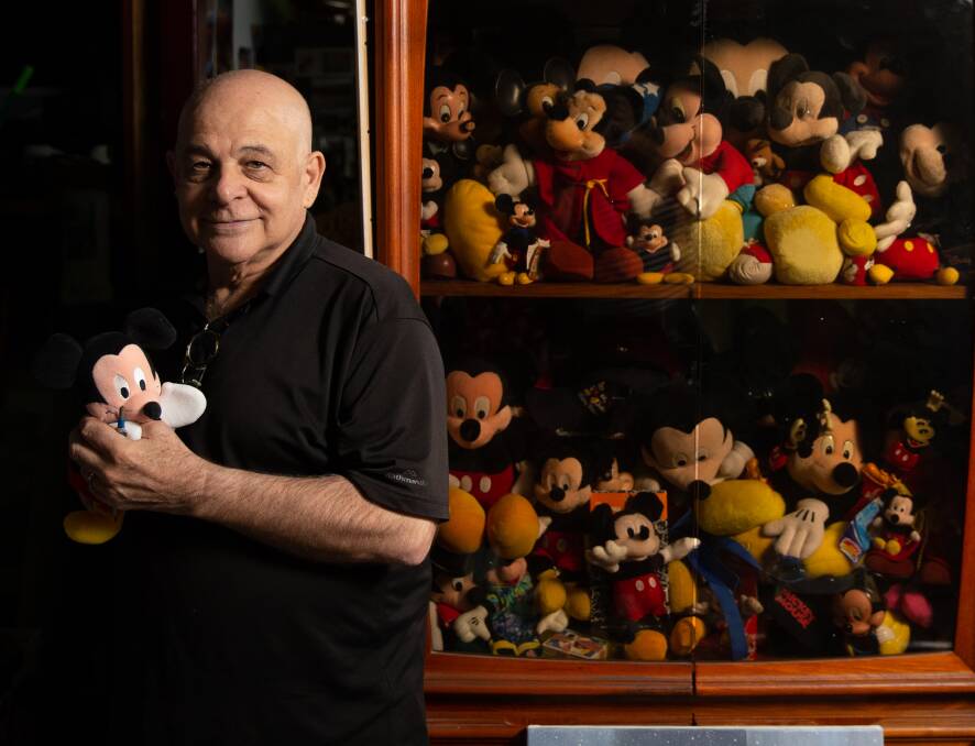 Keen collector: Trevor Weekes with some of his collection of Mickey Mouse memorabilia. Picture: Marina Neil