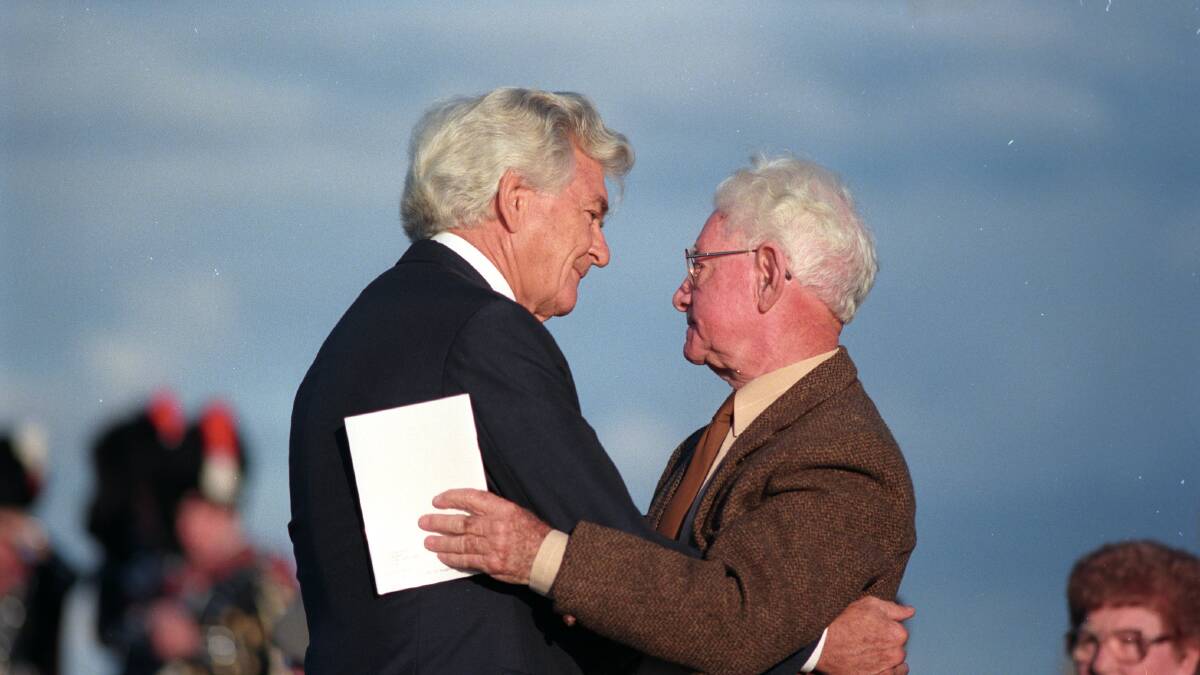Legend: Bob Hawke (left) and Jim Comerford at Fort Scratchley in 1997 for the launch of Comerford's book, Coal and Colonials.