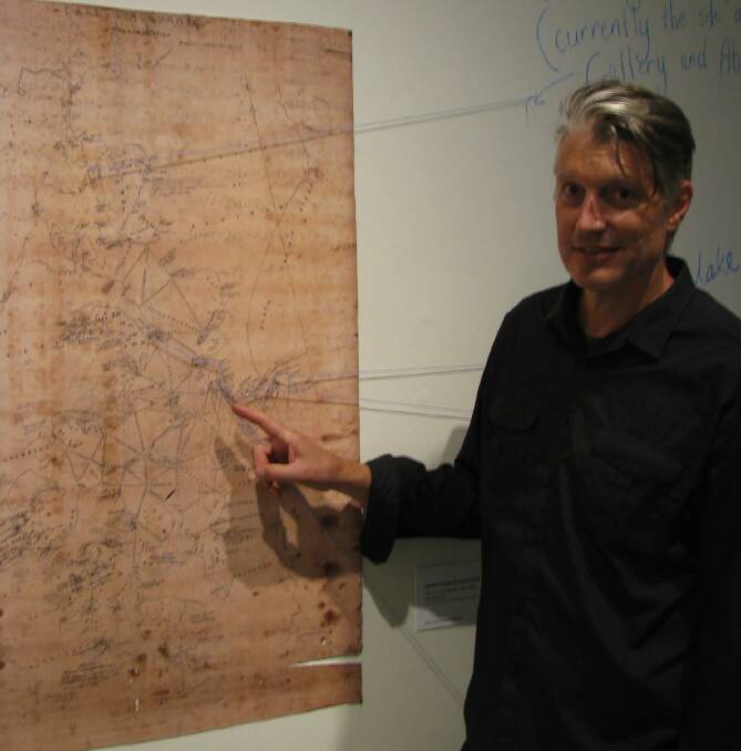 RARE MAP: Gallery exhibitions officer Rob Cleworth with a copy of Deed’s map. 