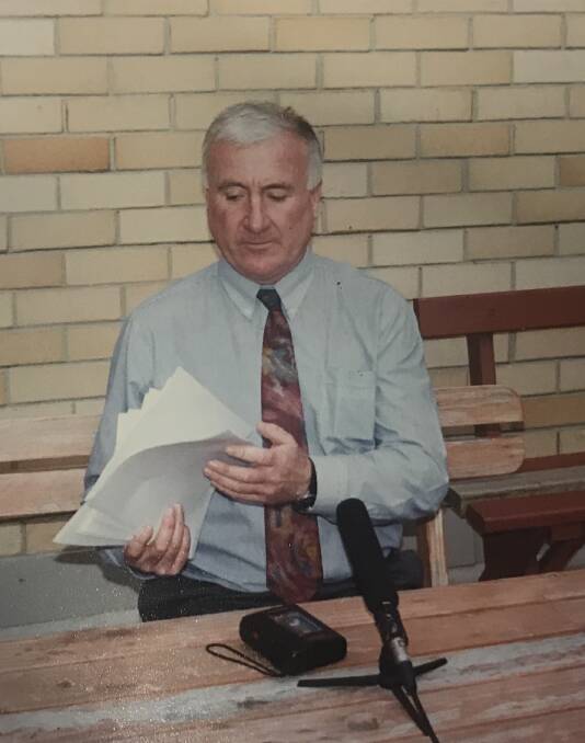 Detective Sergeant Tony Bennett at a press conference in 1997 with copies of the letters Shoobridge wrote to his family. Picture: Melanie Simmonds