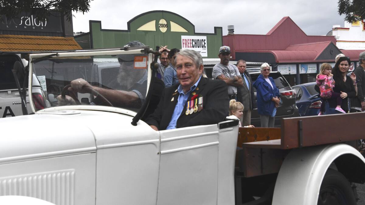 SPIRIT: The Kurri Kurri march was led by army veteran of 28 years, Ron Hourigan, in a vintage car. Picture: Michael Hartshorn