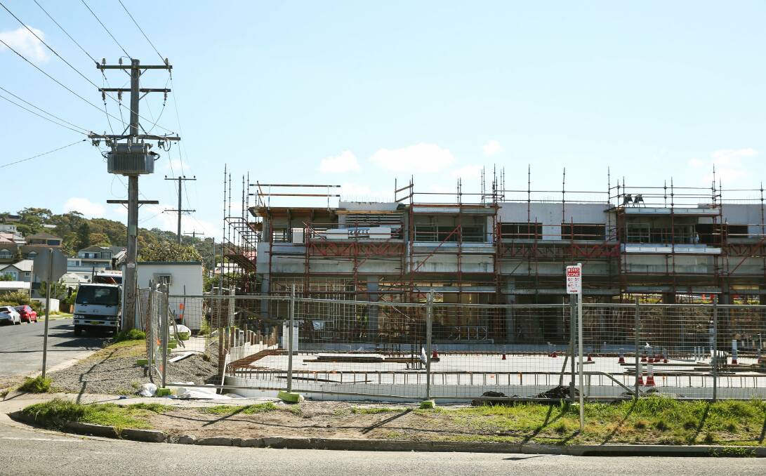 CHANGING FEEL: The mixed-used development under construction on Merewether's Llewellyn Street, which will include a childcare centre, has prompted a Newcastle council traffic plan and street works. Picture: Marin Neil
