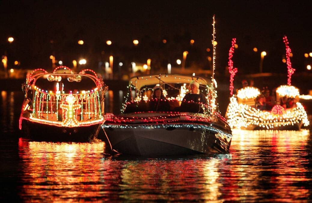 WATER PARADE: Boats in the Palm Coast holiday boat parade, Florida. Flotillas in the US and Europe are inspiration for the inaugural Float Your Boat on Lake Macquarie.