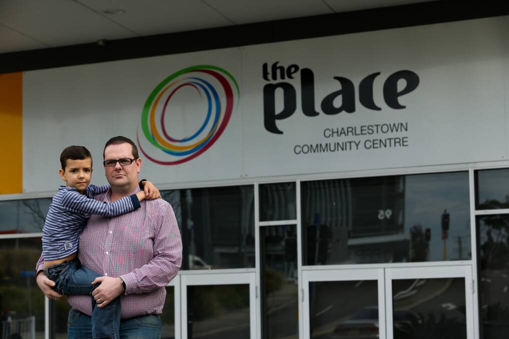 CLOSE TO HOME: Lake Macquarie councillor Kevin Baker, a director of The Place community centre in Charlestown, with his son Lachlan. The Place screened the anti-vaccination film Vaxxed on Friday. Picture: Jonathan Carroll
