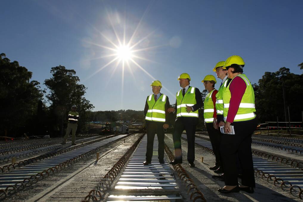 EARLIER WORK: Federal and state Labor MPs Joel Fitzgibbon, Anthony Albanese, Jodie Harrison and Meryl Swanson inspect work on the Lake Macquarie Transport Interchange last year. Picture: Jonathan Carroll