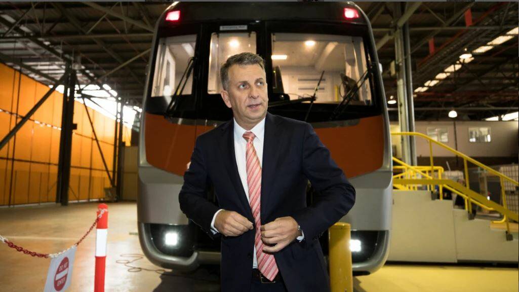 Transport Minister Andrew Constance in front of a mock of one of the new intercity trains. Picture: Janie Barrett