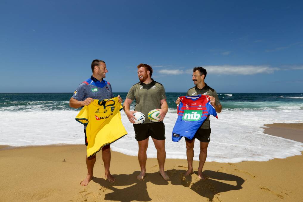 IT'S ON: Wallabies Nic White and Harry Johnson-Holmes with Knights player Blake Green at Merewether. Picture: Jonathan Carroll 