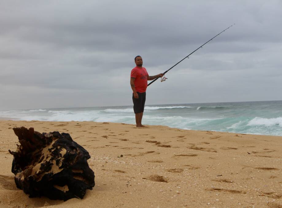 KEEPING BUSY: Chef and business owner Emerson Rodriguez at Stockton beach on a day off. Pictures: Daniel Honan