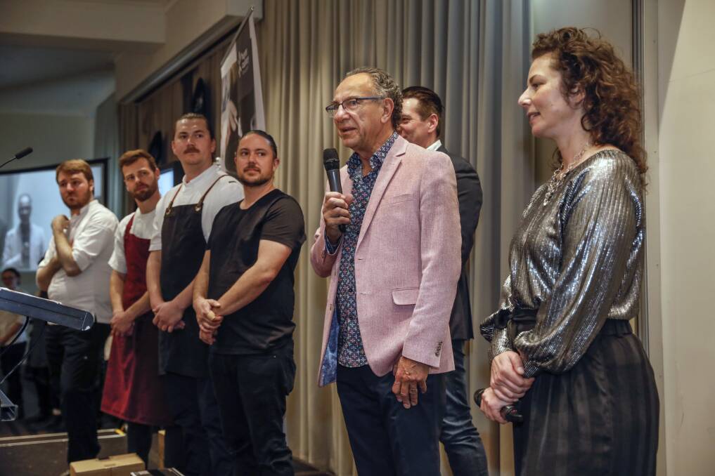 FOOD FIGHT 2022: Gus Maher (holding microphone) with the 2022 Food Fight chefs and MCs Justin North and Dani Valent.