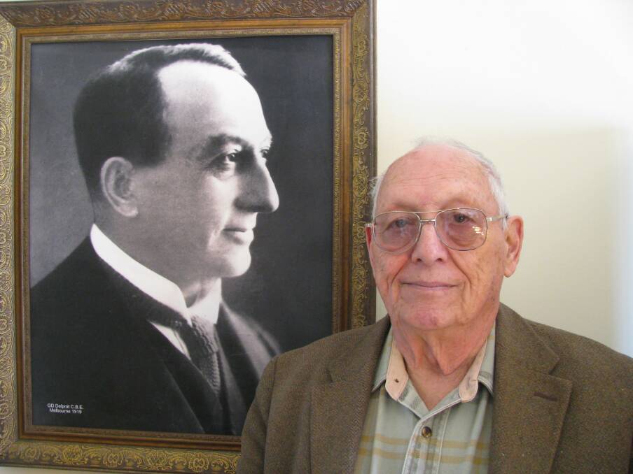 RESEMBLANCE: Carl Delprat, in Delprat Cottage, beside a portrait of his great grandfather G.D Delprat. Picture: Mike Scanlon