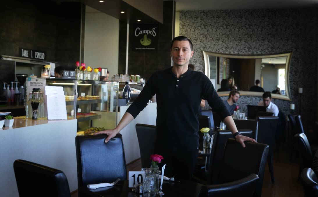 AMBITIOUS: George James at Table 1 Espresso, Merewether, in 2015. Picture: Marina Neil