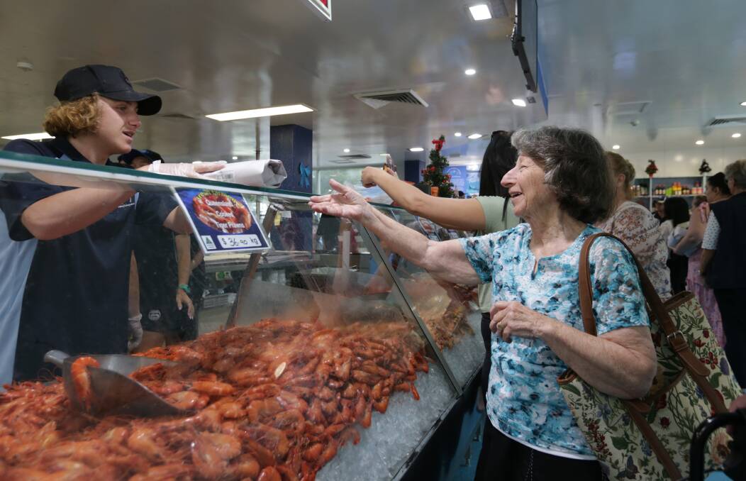 FRESH IS BEST: Sally MacWilliam of Newcastle purchasing king prawns for Christmas last December at Newcastle Commercial Fishermen's Co-operative. Picture: Simone De Peak