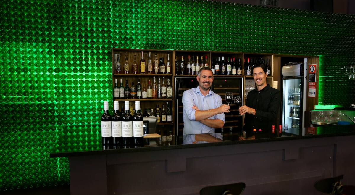 THREE CHEERS: Reserve Wine Bar owner Patrick Haddock, left, and manager Pat Hester. Picture: Jonathan Carroll 