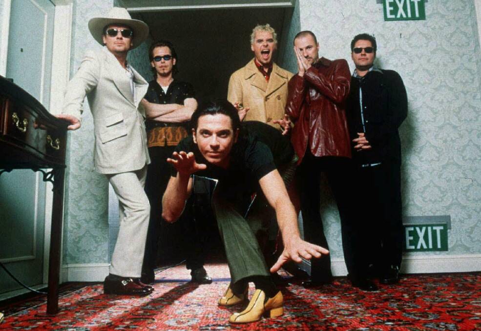 CHART TOPPERS: Andrew Farriss, far right, with INXS in 1997. 