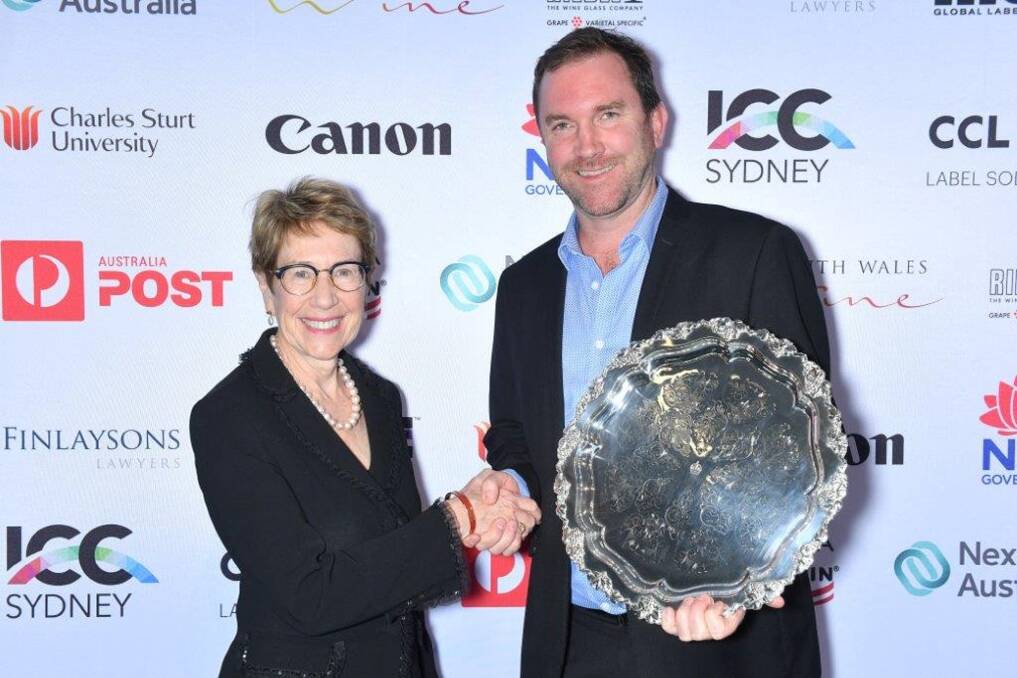 SUCCESS: NSW Governor Margaret Beazley AO, QC presents Mount Pleasant chief winemaker Adrian Sparks with her trophy for the 2019 NSW Wine of the Year.