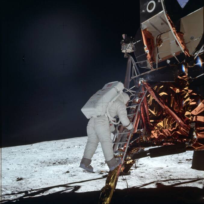 Buzz Aldrin descends a ladder onto the moon's surface. Picture: Neil Armstrong/NASA 