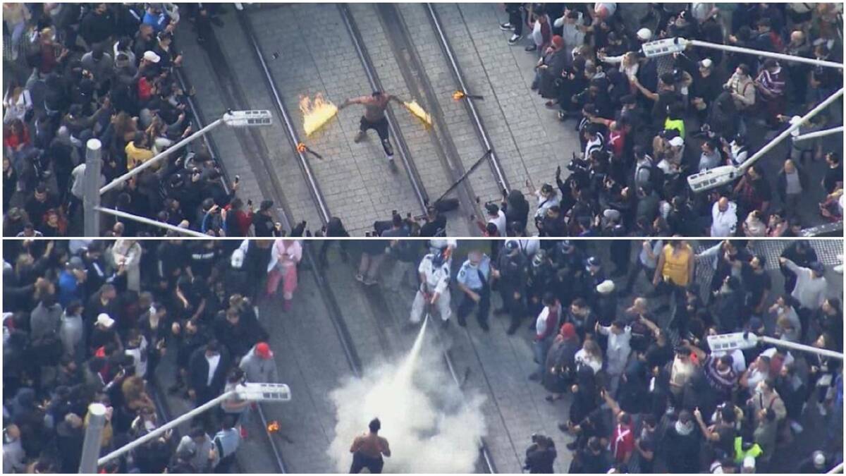 Fired Up: A fire-twirler at the Sydney lockdown protest was the only one social distancing. Pictures: Twitter 